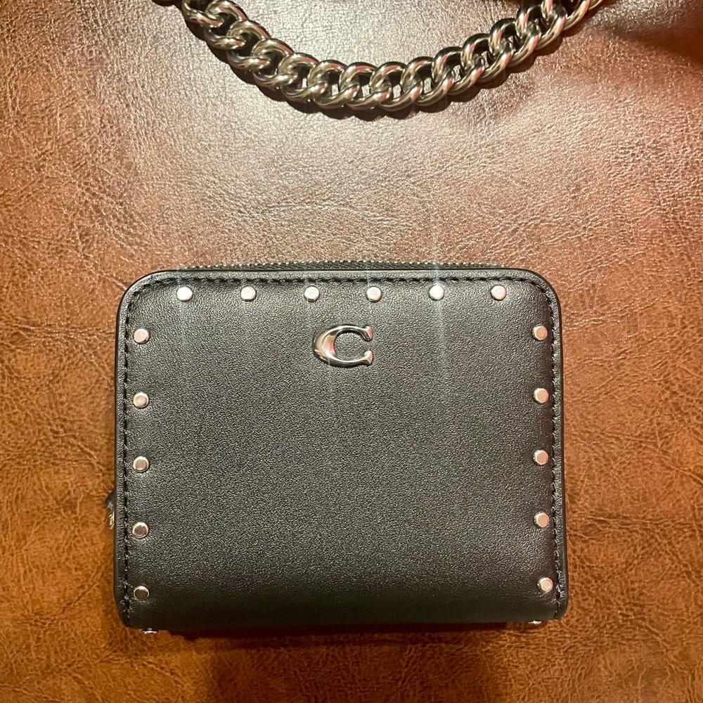 Coach black leather wallet with rivets